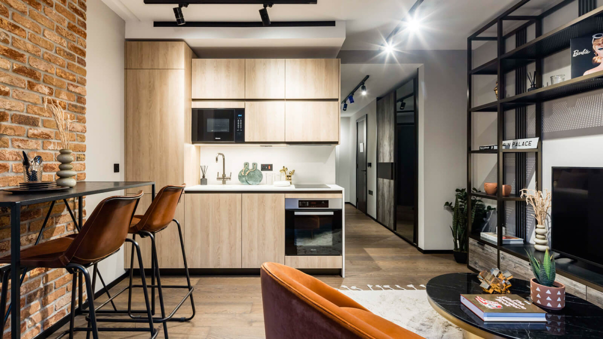 Open-plan living room and kitchen in a studio suite at The Stage, ©Galliard Homes.