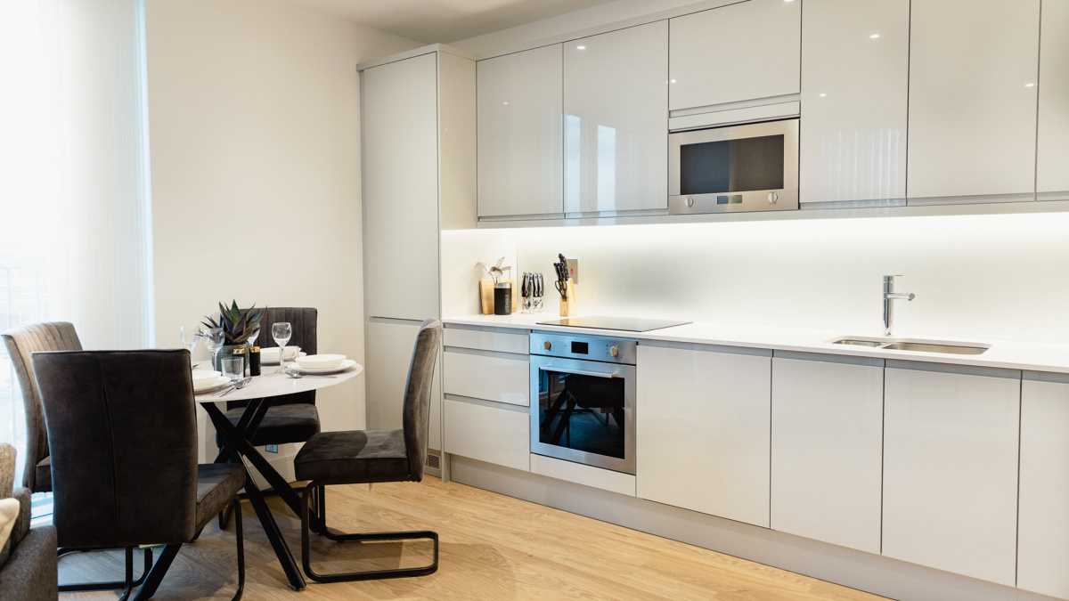 Open-plan living, kitchen and dining area at a Timber Yard apartment, ©Galliard Homes.