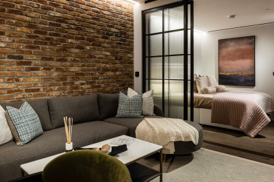 Open-plan living and bedroom area in a studio suite at The Stage, ©Galliard Homes. Open-plan living and bedroom area in a studio suite at The Stage, ©Galliard Homes.