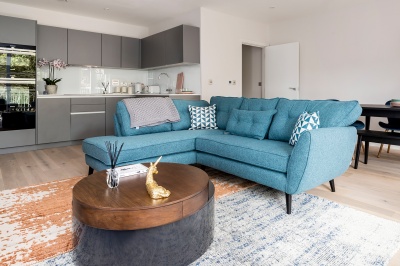 Kitchen and living area in a Trilogy show apartment, ©Acorn Property Group. Kitchen and living area in a Trilogy show apartment, ©Acorn Property Group.