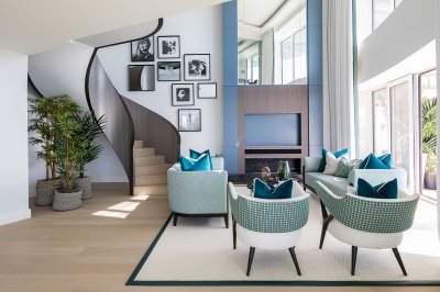 Penthouse living area with double-height ceilings, and staircase to the upper level, ©Galliard Homes. Penthouse living area with double-height ceilings, and staircase to the upper level, ©Galliard Homes.