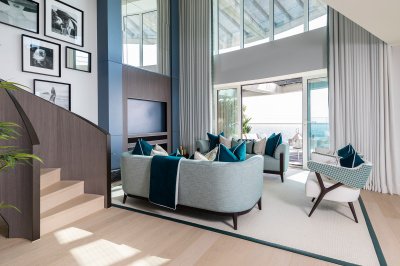 Penthouse living area with double-height ceilings, and staircase to the upper level, ©Galliard Homes. Penthouse living area with double-height ceilings, and staircase to the upper level, ©Galliard Homes.