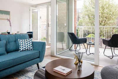 Living and balcony area in a Trilogy apartment, ©Acorn Property Group. Living and balcony area in a Trilogy apartment, ©Acorn Property Group.