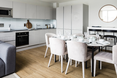 Open-plan kitchen, living area at a Wimbledon Grounds apartment, ©Galliard Homes.