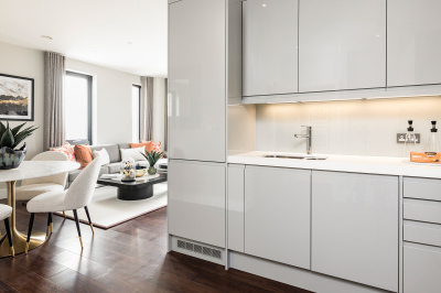 Open-plan kitchen, living and dining area at an Orchard Wharf apartment, computer generated image intended for illustrative purposes only, ©Galliard Homes.