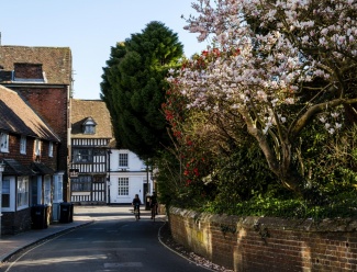 Living in East Grinstead, West Sussex Location of East Grinstead, cyclists riding down a street