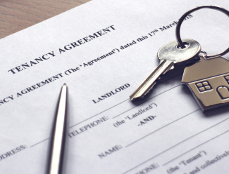 A tenancy agreement and a key.